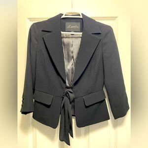Black blazer with tie to close.